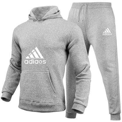 Stylish and trendy fitness jogging loose sportswear set of 2-piece pullover hoodie and long pants for men in autumn and winter